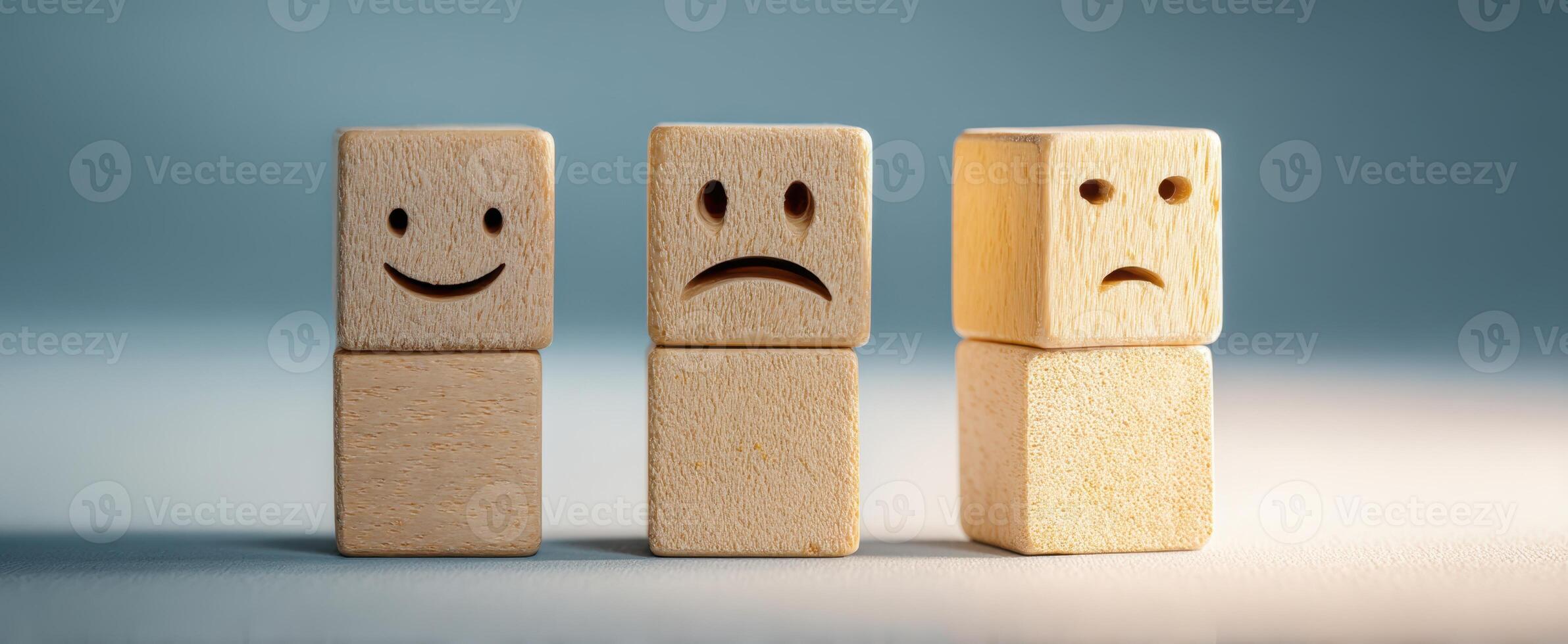 The emotional journey represented by wooden blocks showcasing different expressions. photo