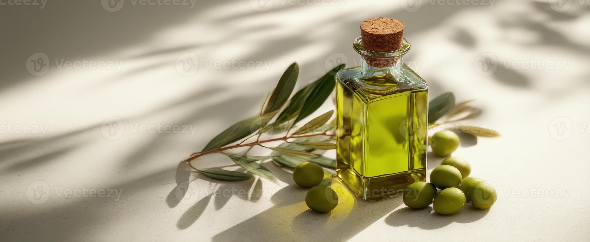 The Olive Oil Bottle Surrounded by Fresh Olives and Leaves Under Soft Light photo