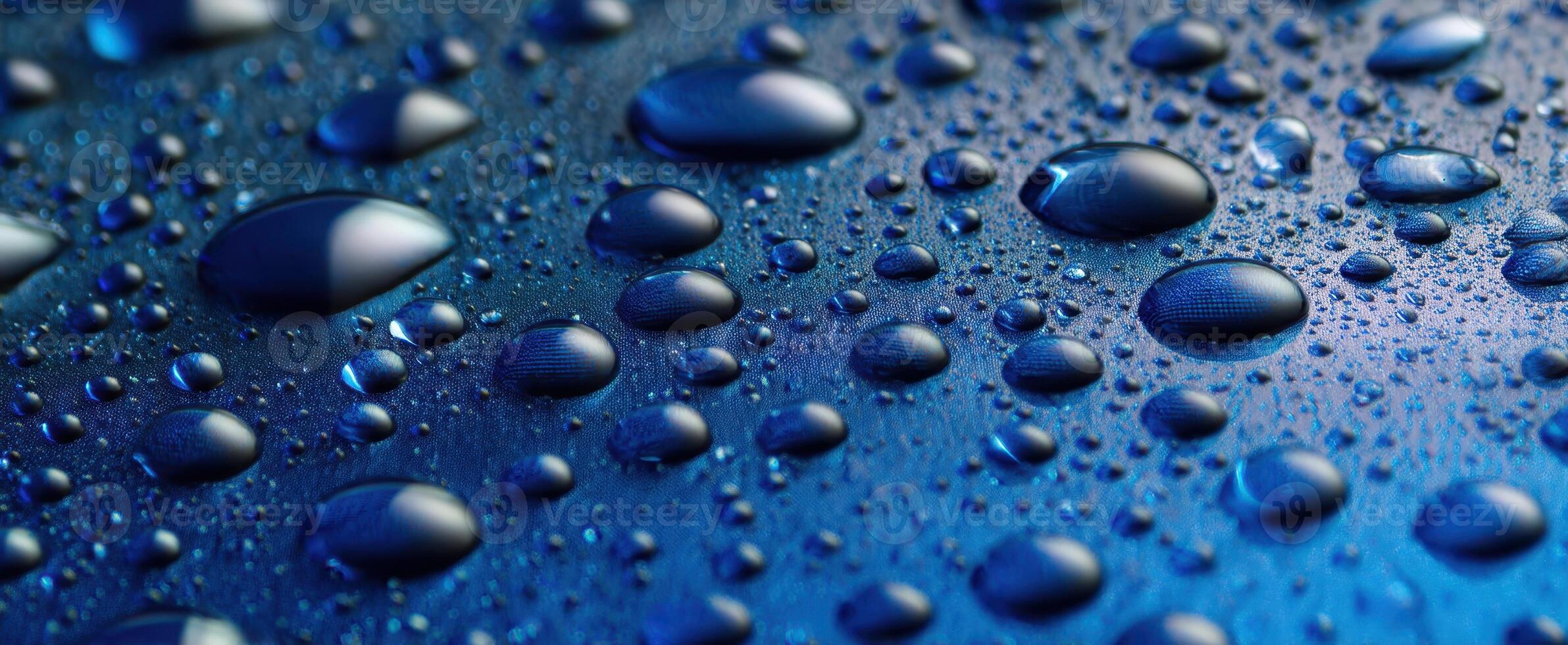 The Glimmering Water Droplets on a Blue Surface photo