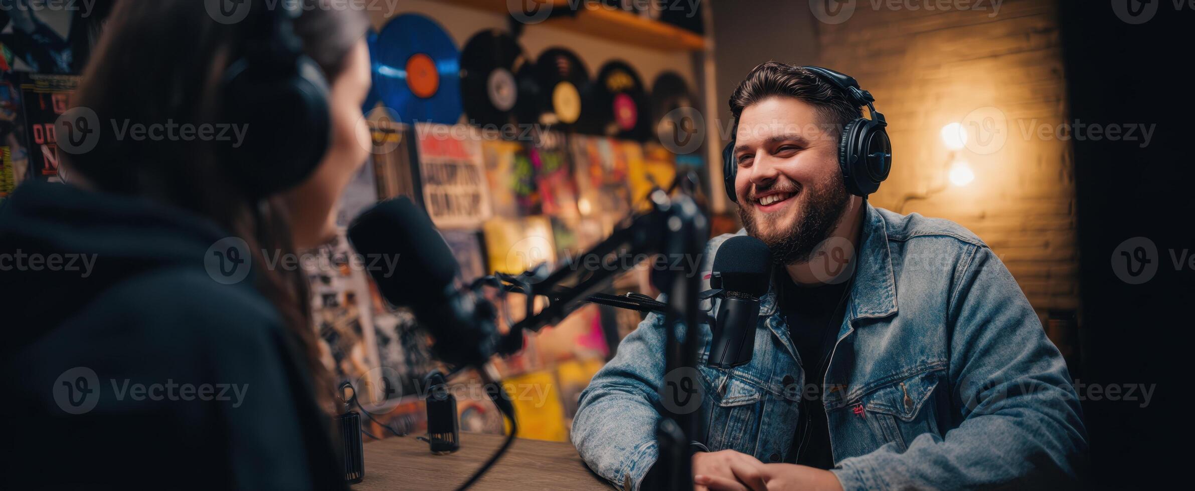 The engaging podcast hosts share laughter and stories in a creative studio setting. photo