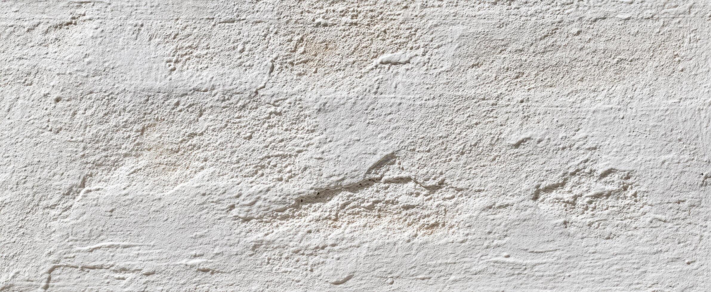 The textured white wall showcasing a rustic and minimalist surface design. photo