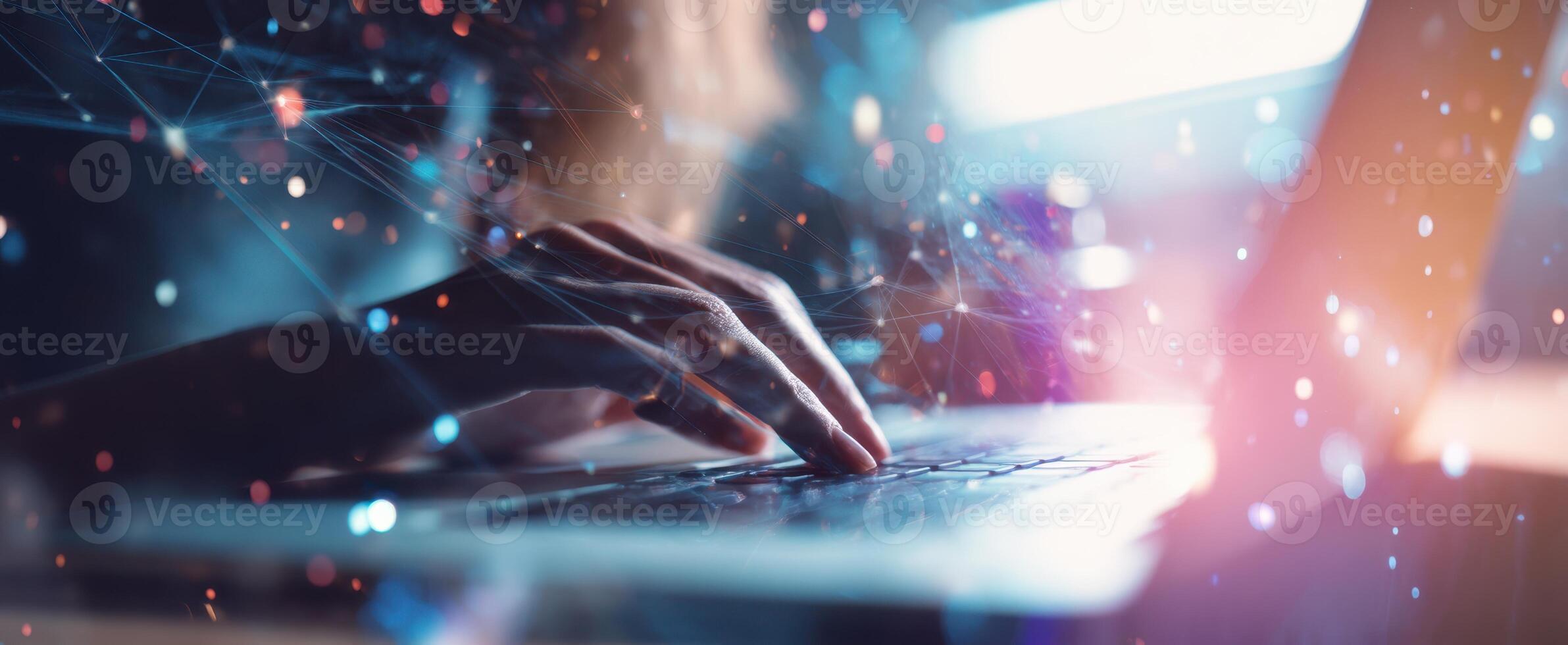 The laptop being used with hands engaged in digital interaction and creativity. photo