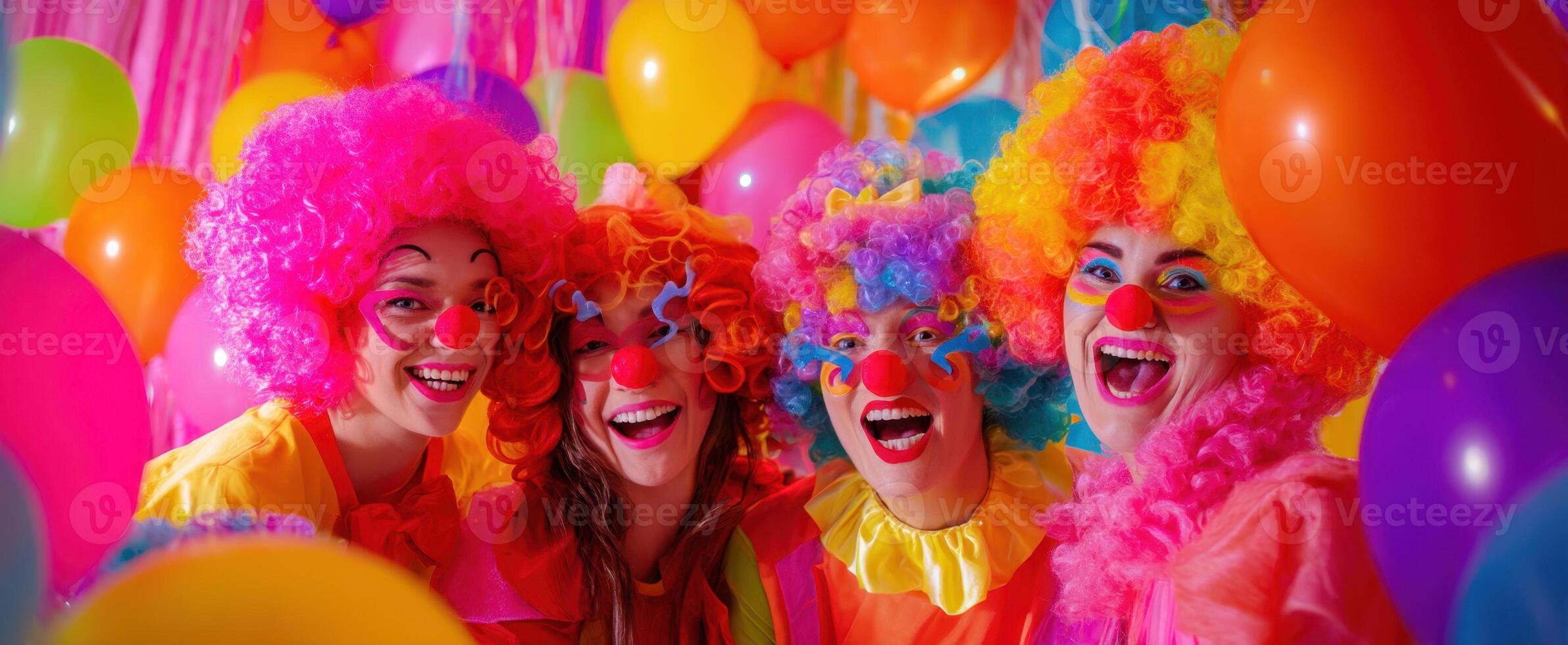 The joyful clowns celebrating in a vibrant party atmosphere with balloons. photo