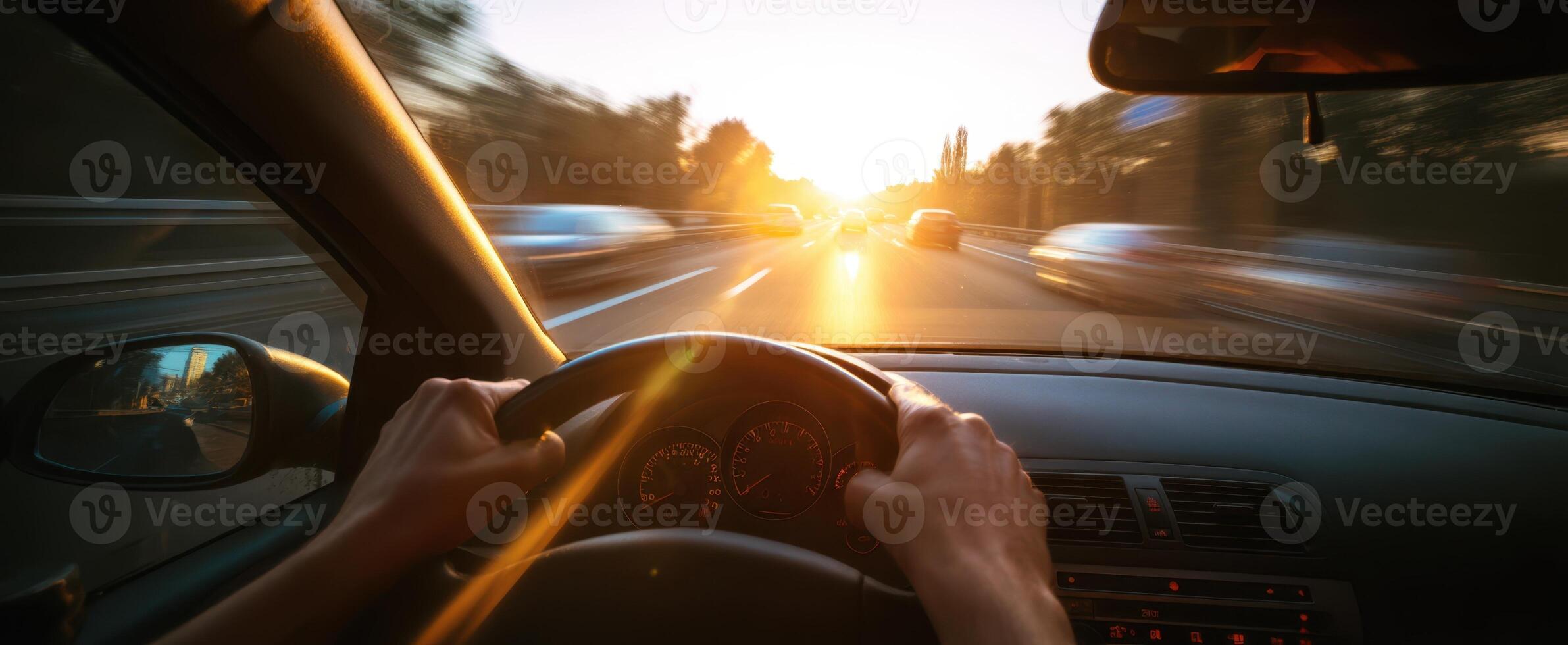 The car driving into the sunset on a busy highway scene photo