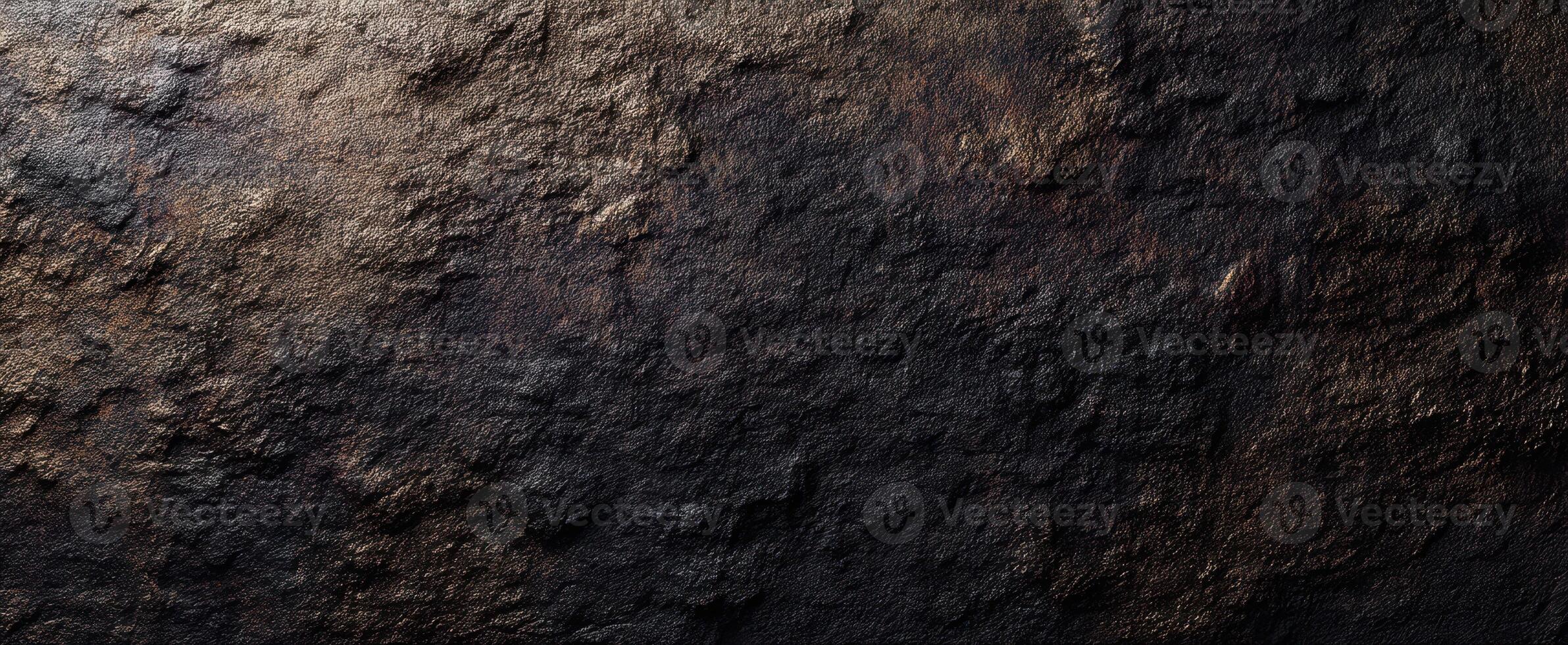 The textured dark surface showcasing a rich, metallic finish and abstract patterns. photo