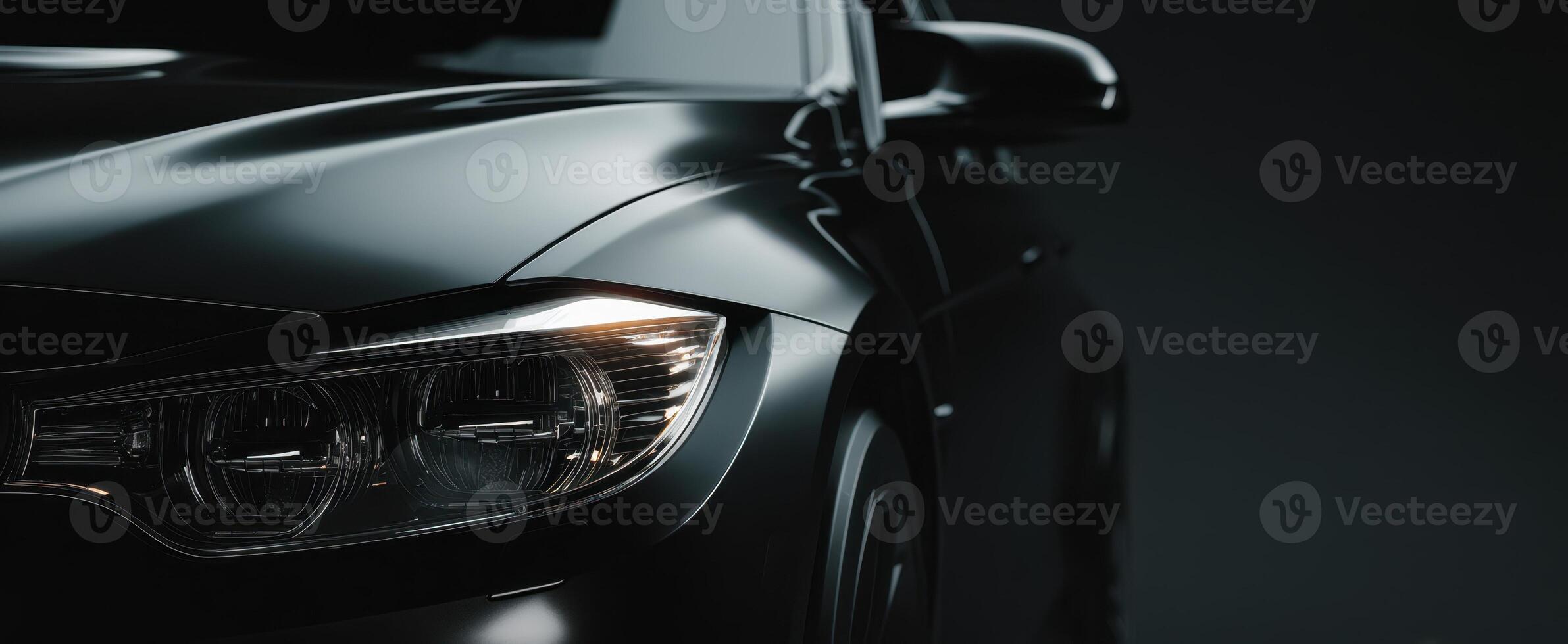 The black luxury car elegantly emphasizing its modern design and sleek features. photo