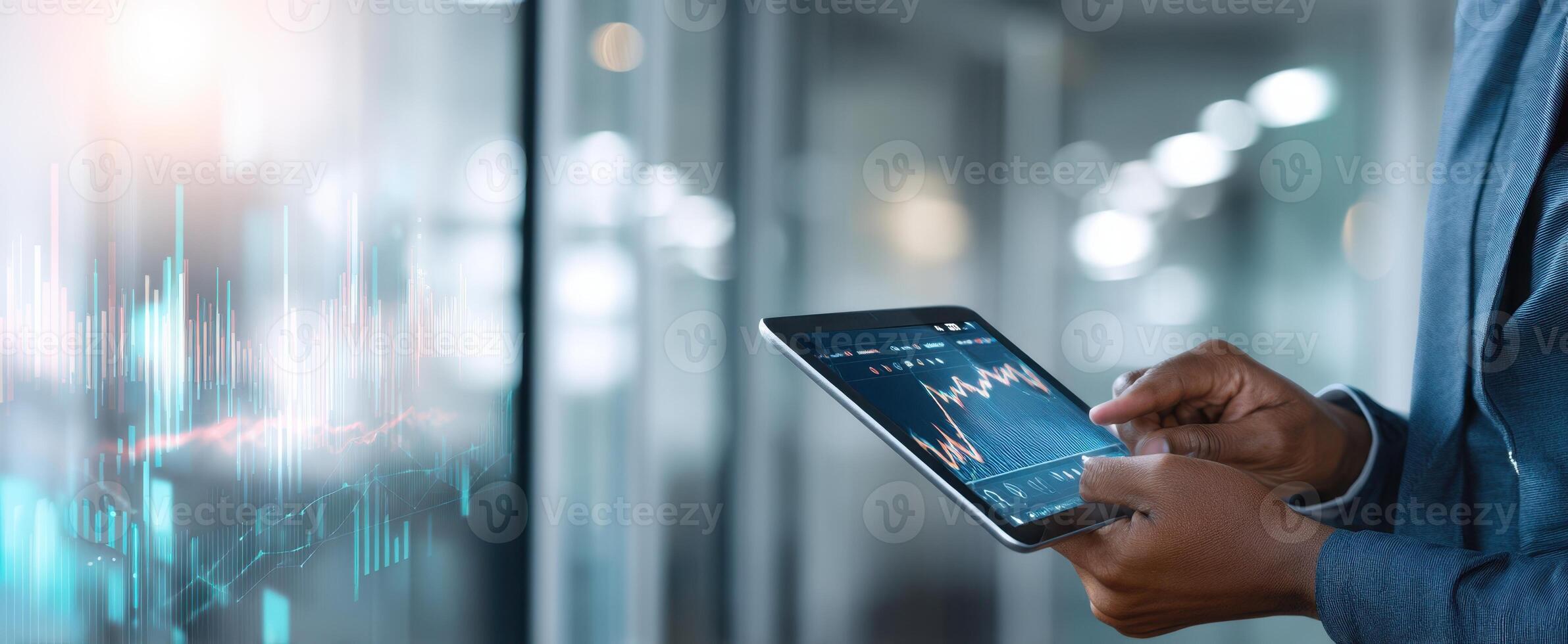 The tablet displaying financial data and analytics in a modern office setting. photo