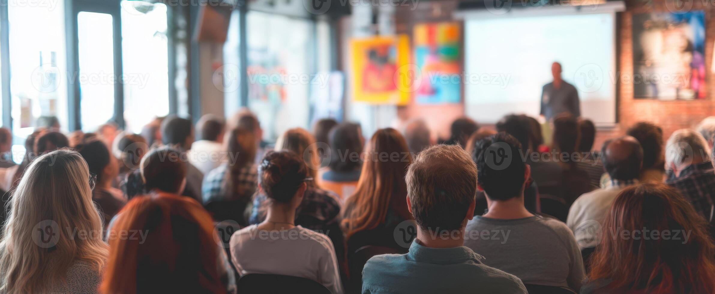 The audience engaged during a lively presentation in a modern venue photo