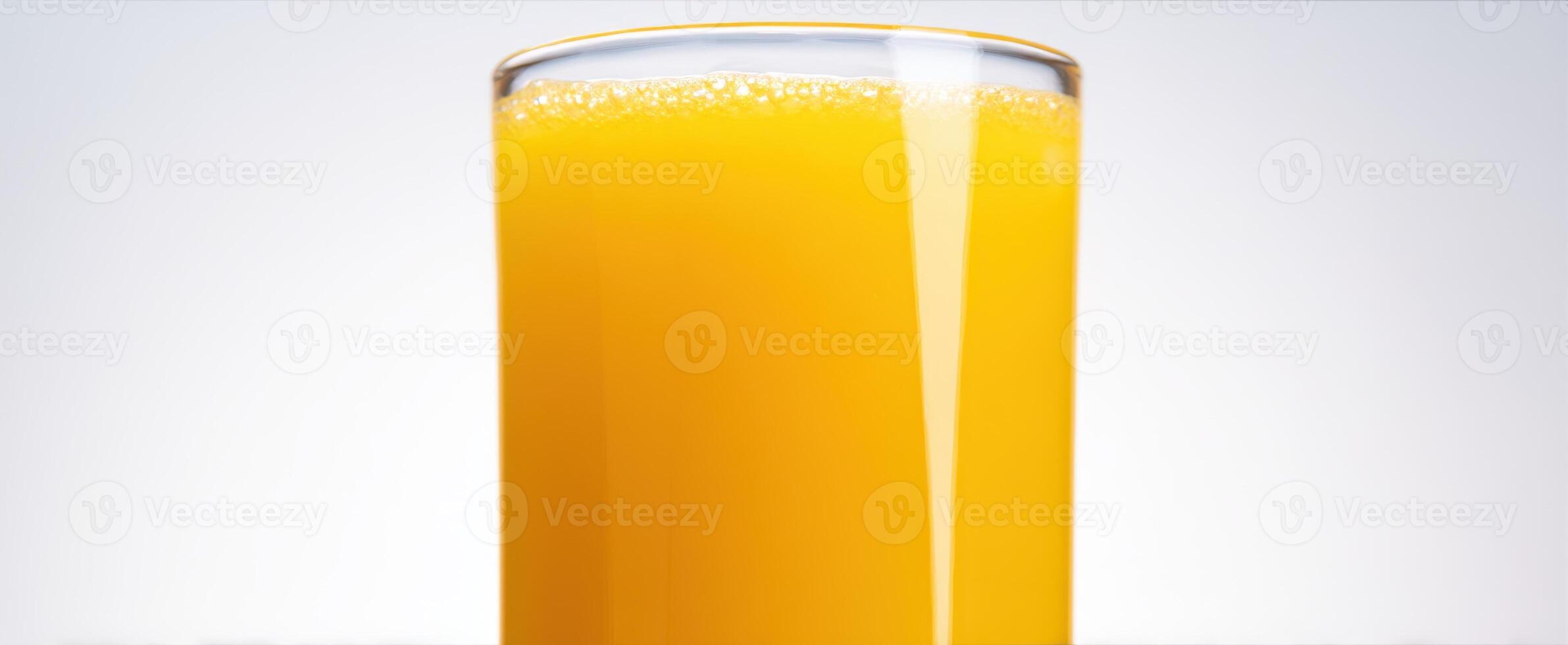 The Glass of Fresh Orange Juice with Vibrant Color and Refreshing Appeal photo