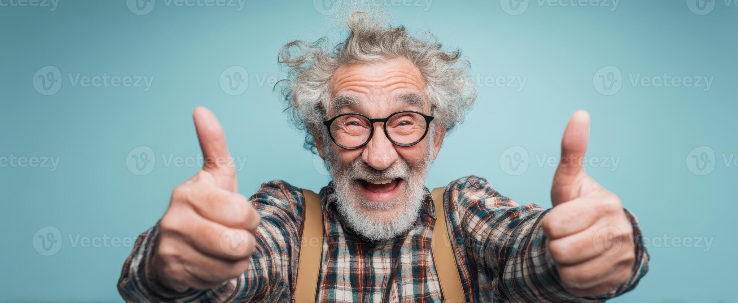 The joyful elderly man giving two thumbs-up with a big smile. photo