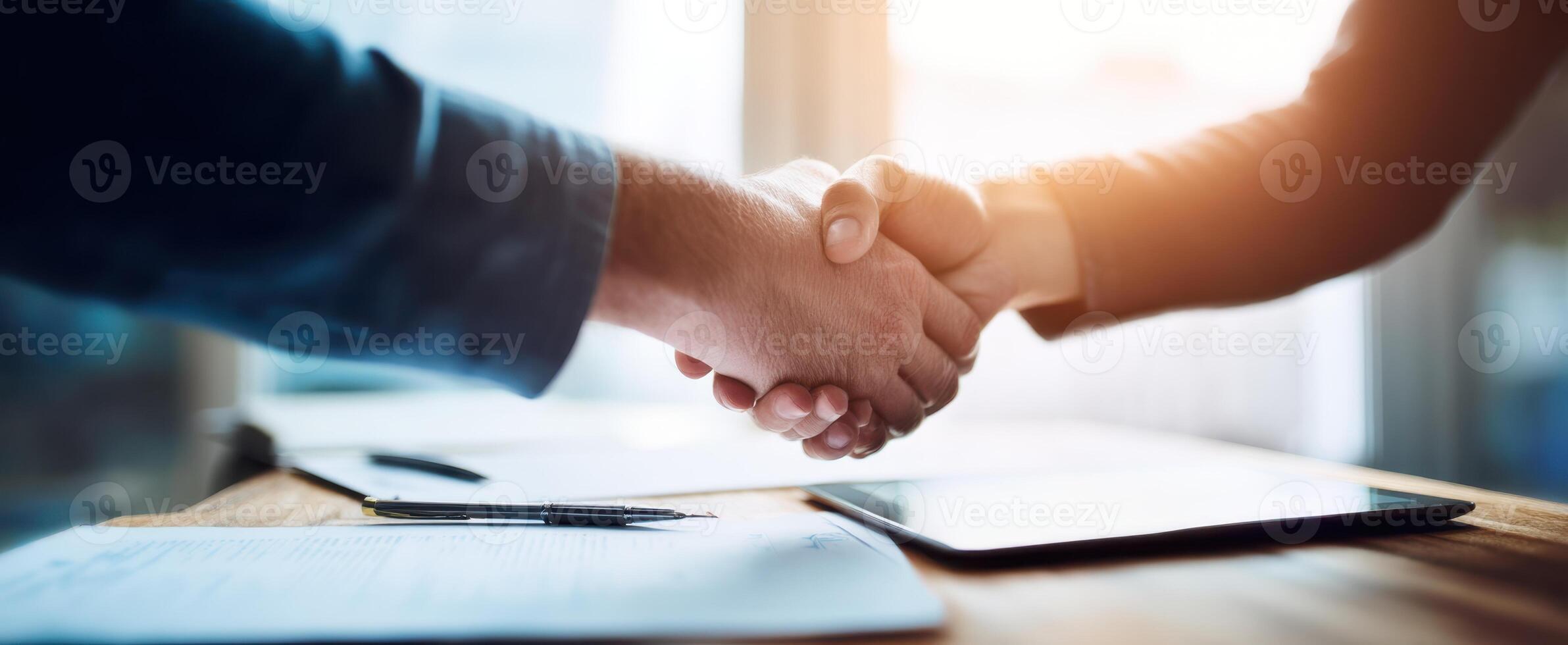 The handshake representing a successful business agreement between two professionals. photo