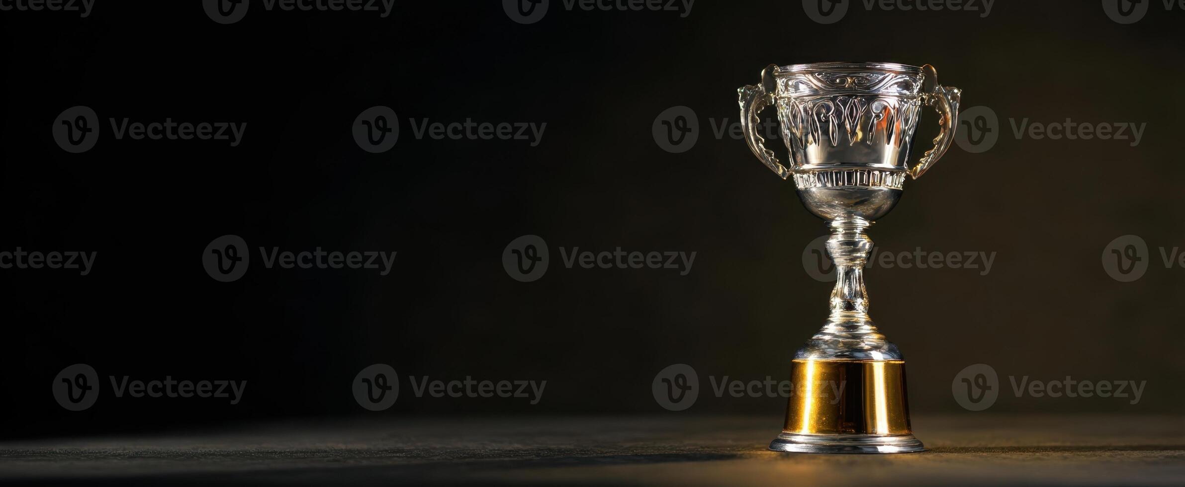 The elegant trophy shining in the spotlight symbolizes achievement and victory. photo