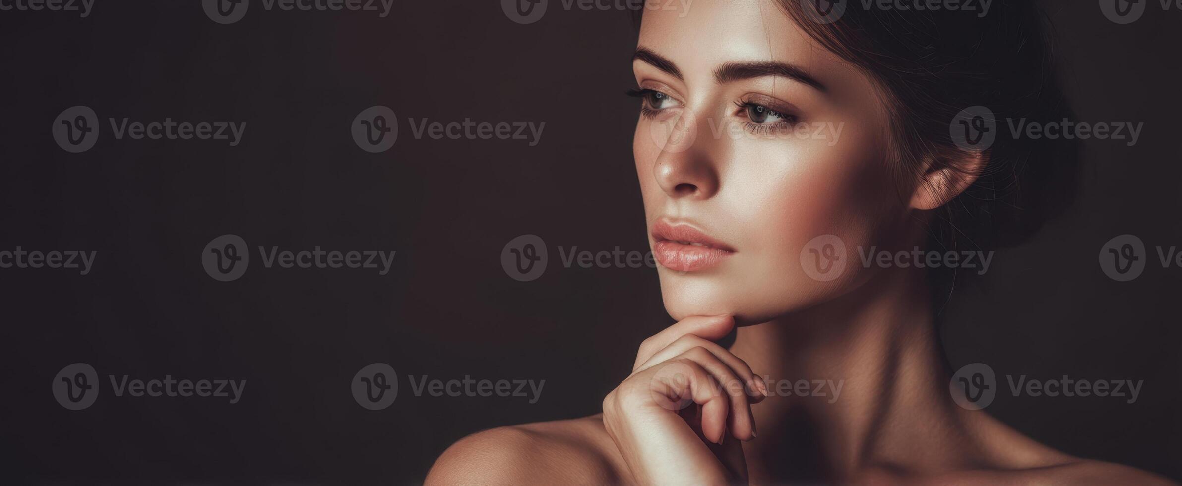 The captivating portrait of a serene beauty in soft lighting. photo