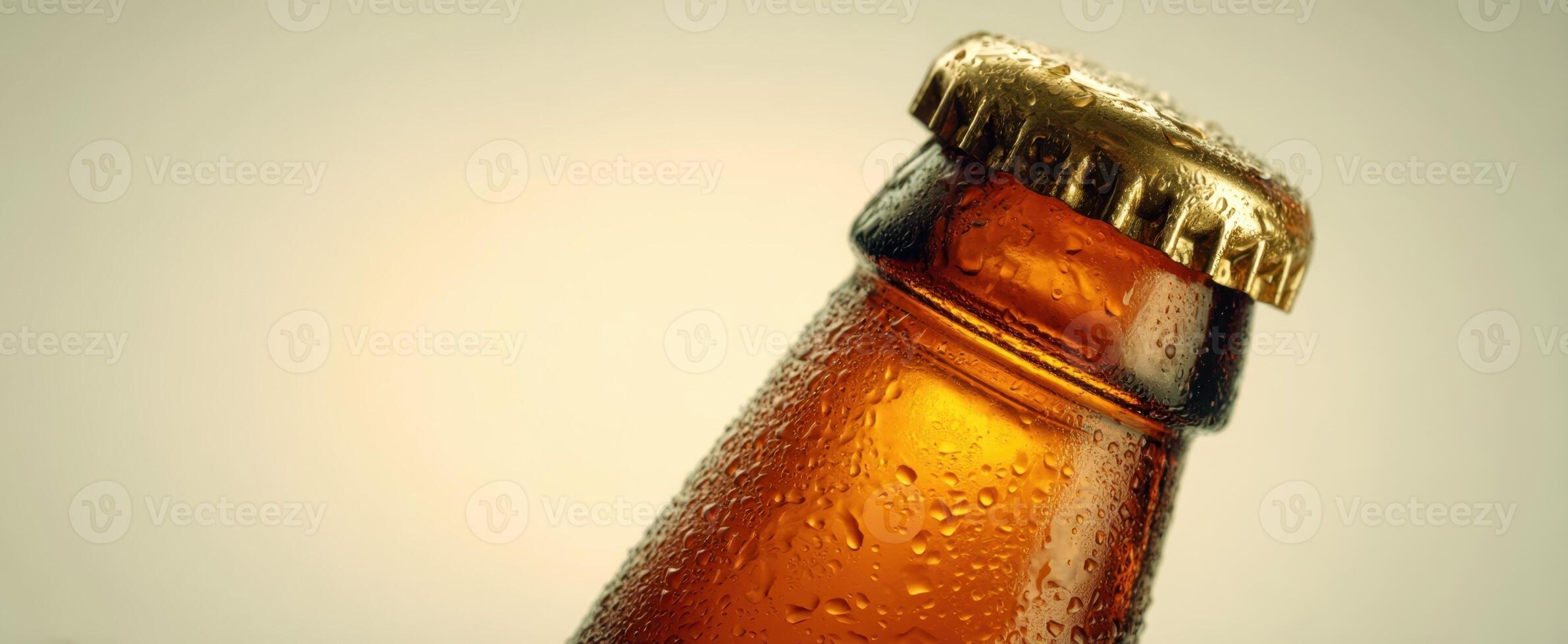 The chilled bottle of beer showcasing droplets of condensation. photo