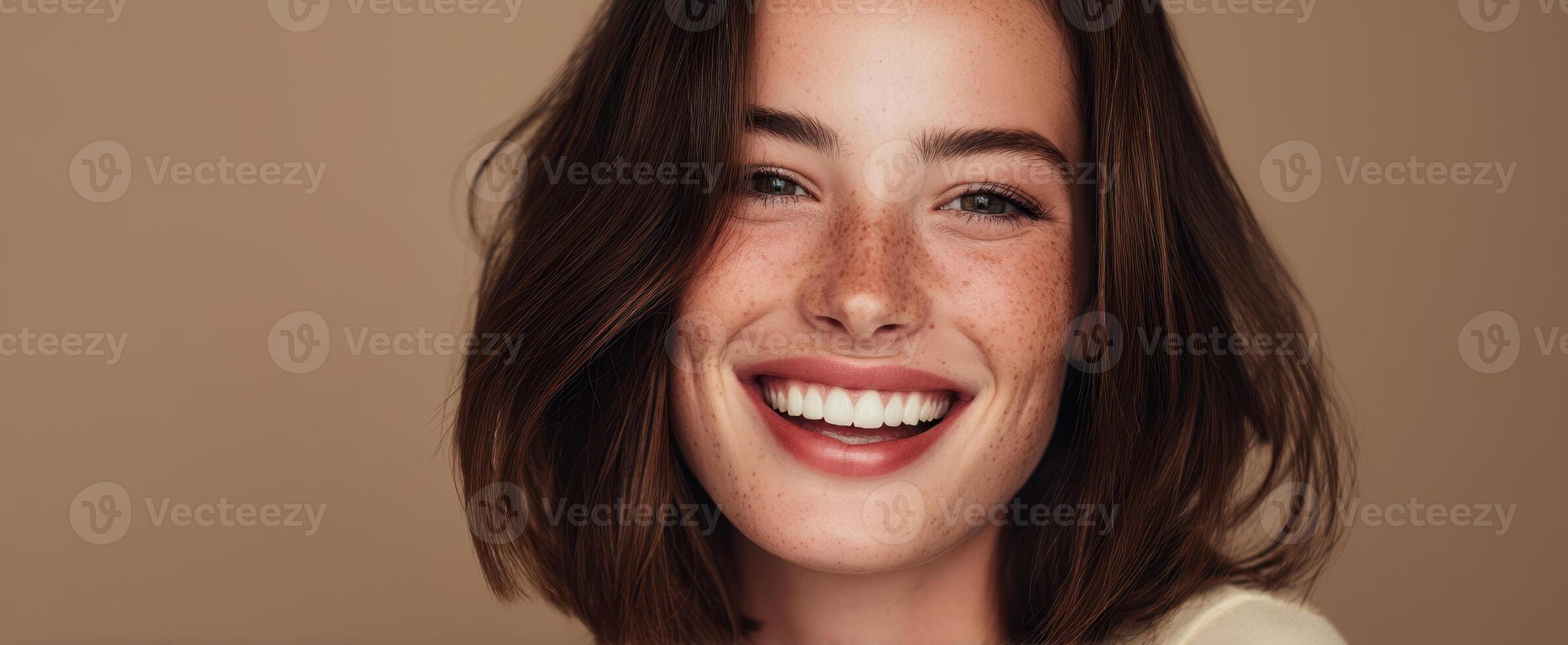 The joyful woman with beautiful freckles and a radiant smile. photo