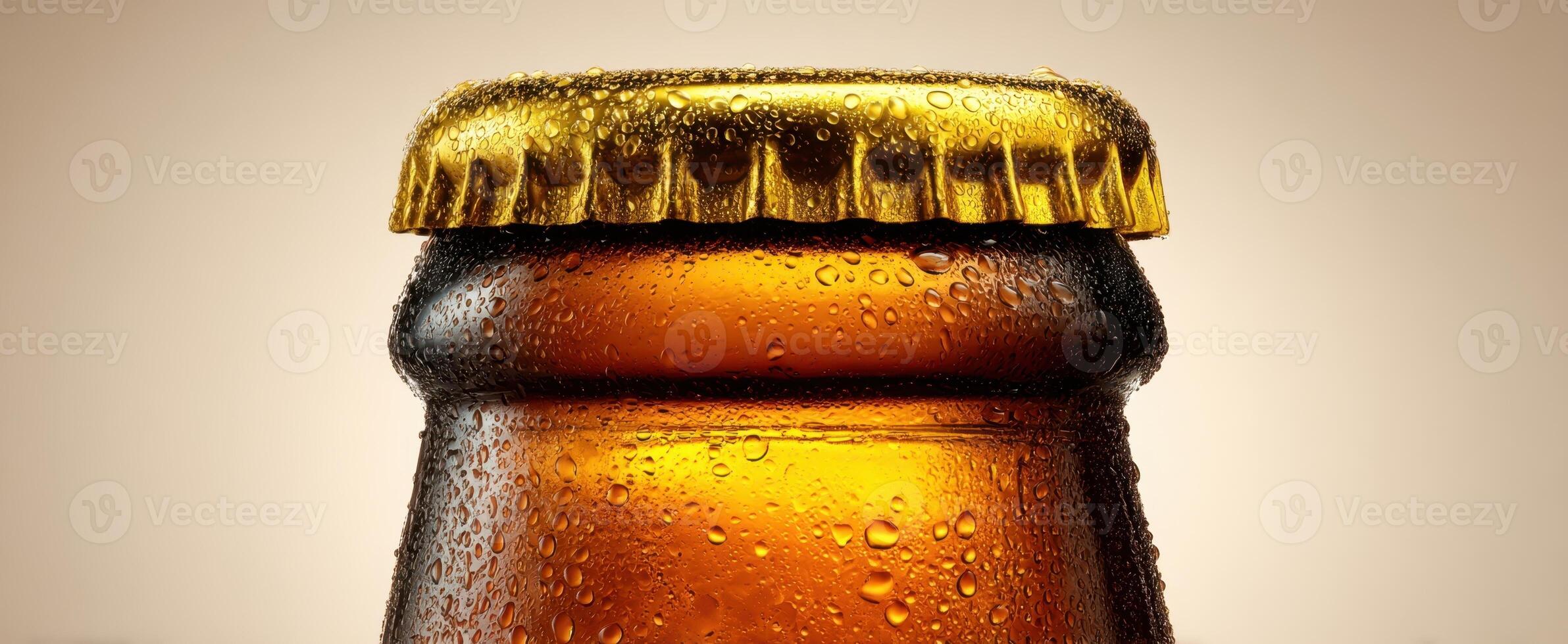 The refreshing beer bottle with condensation and a golden cap. photo
