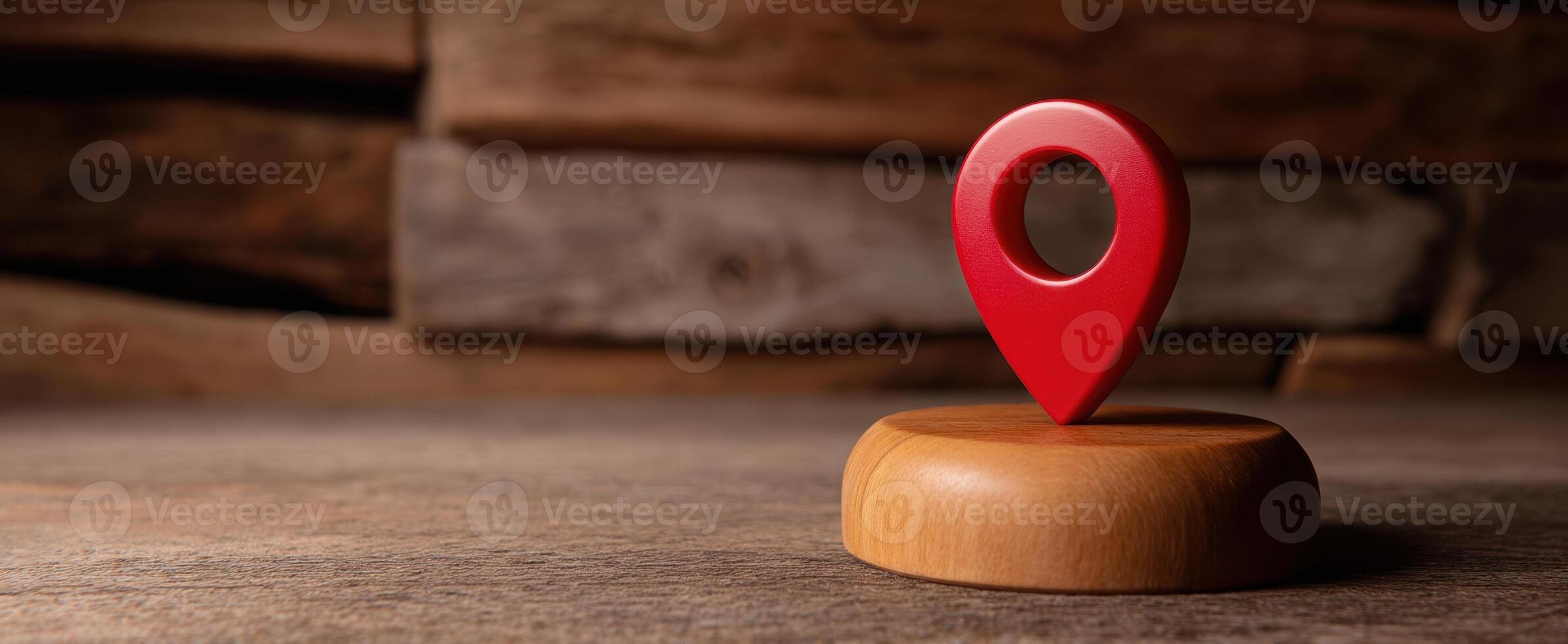 The Red Location Marker on a Wooden Base Against a Rustic Background photo