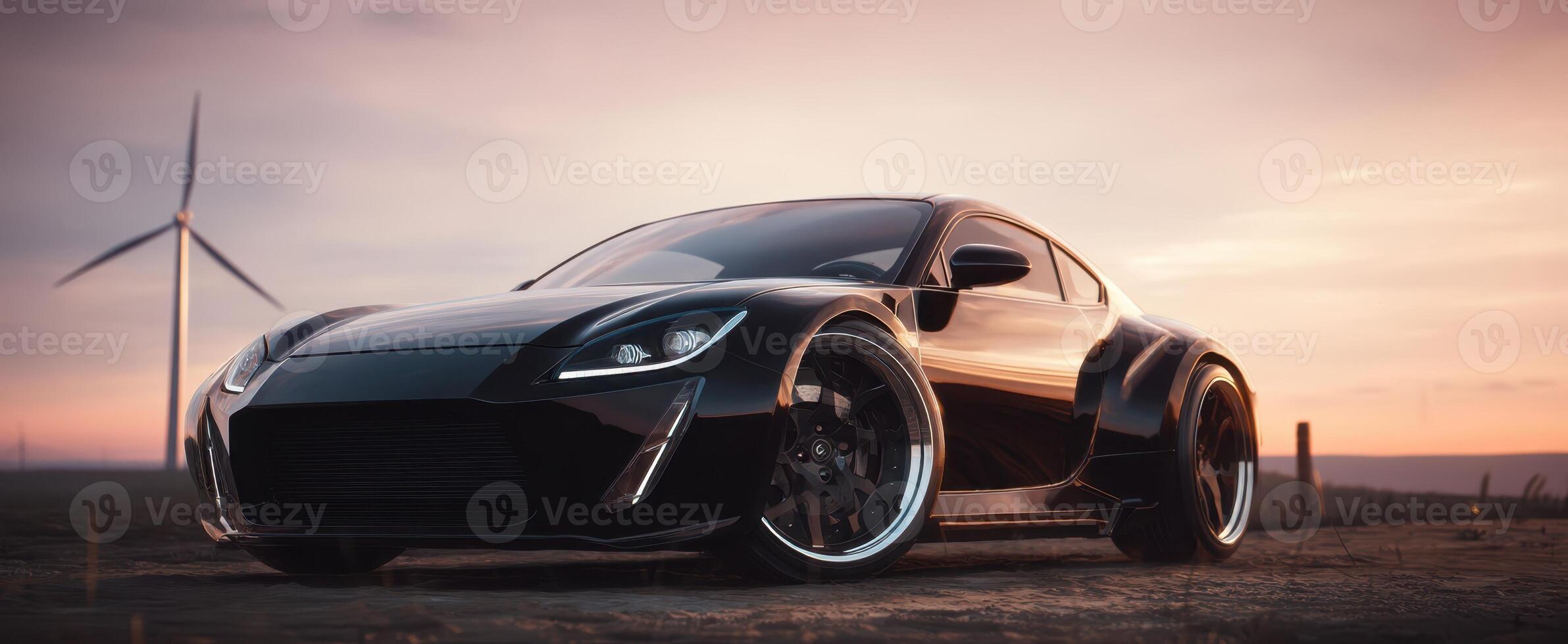 The impressive black sportscar against a stunning sunset backdrop. photo
