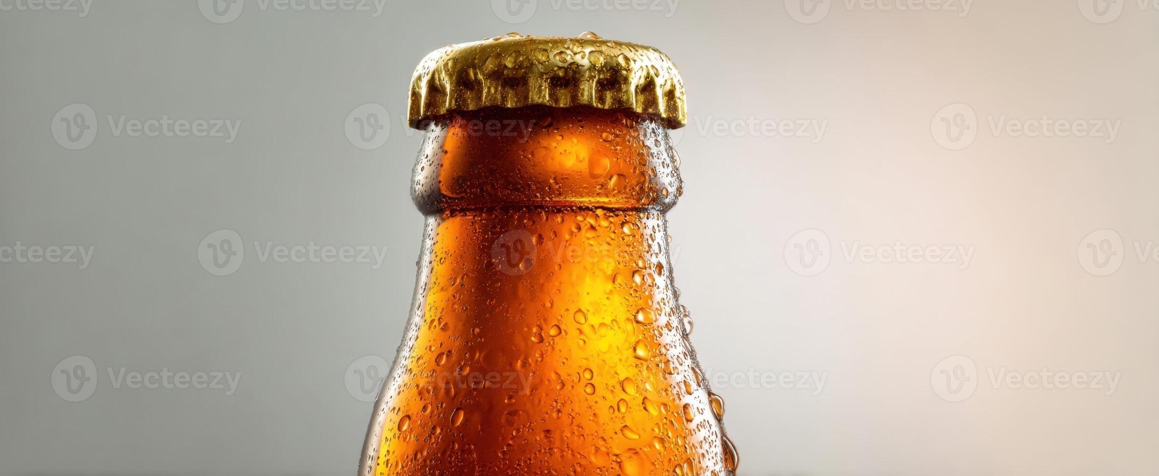 The refreshing glass bottle of amber beer with condensation beads. photo