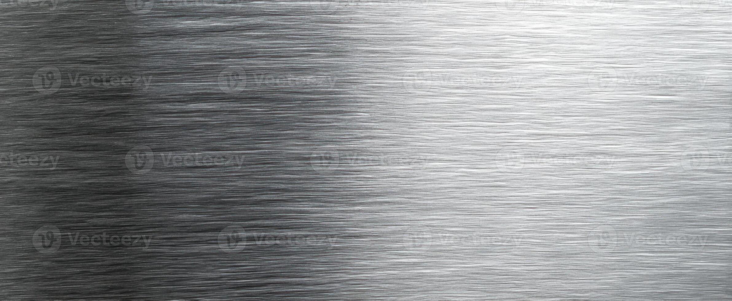 The Brushed Silver Metal Surface with a Smooth Shiny Texture photo