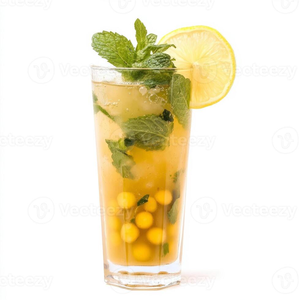 A glass of lemonade with a lemon wedge and mint leaves photo