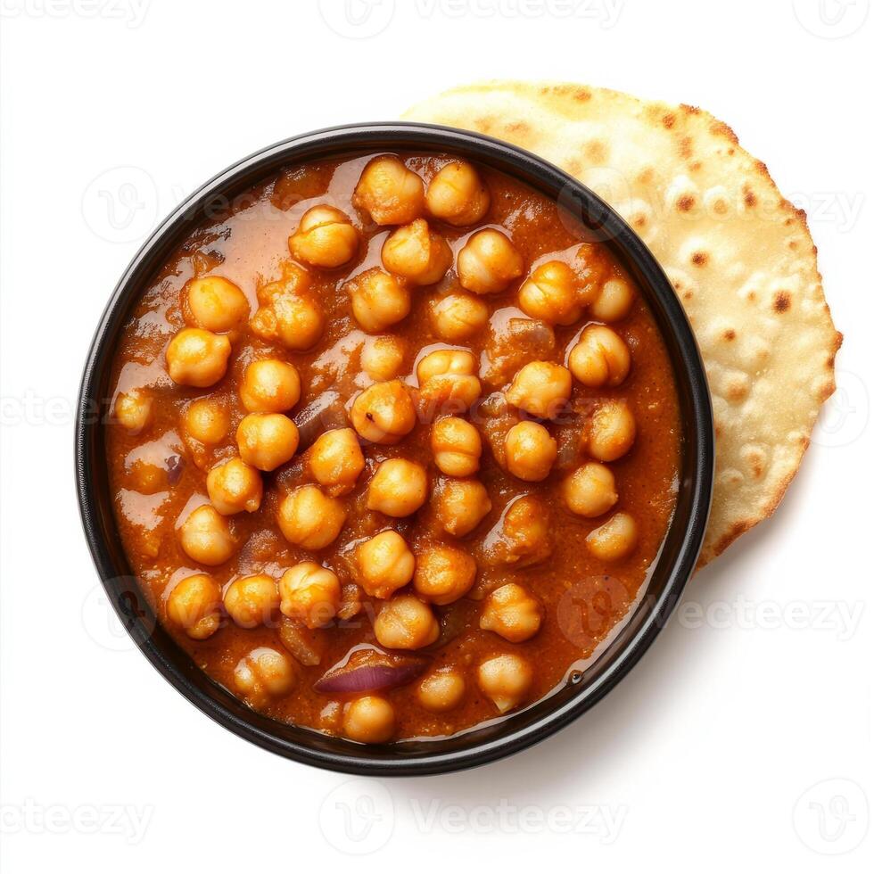 A bowl of chana masala, with chickpeas cooked in a spicy tomato and onion sauce, served with bhatura photo