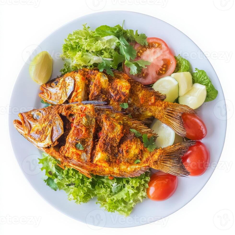 A plate of fish recheado, with fish stuffed with a spicy masala and fried until crispy, served with photo
