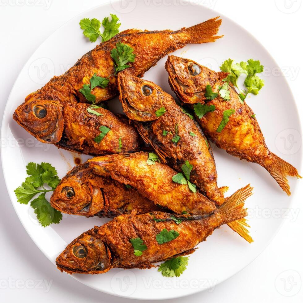 A plate of fish recheado, with fish stuffed with a spicy masala and fried until crispy, isolated on photo