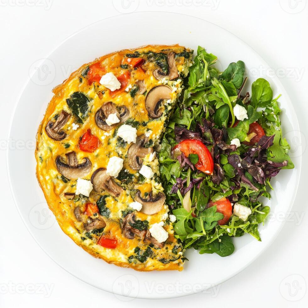 A plate topped with a quiche and salad photo