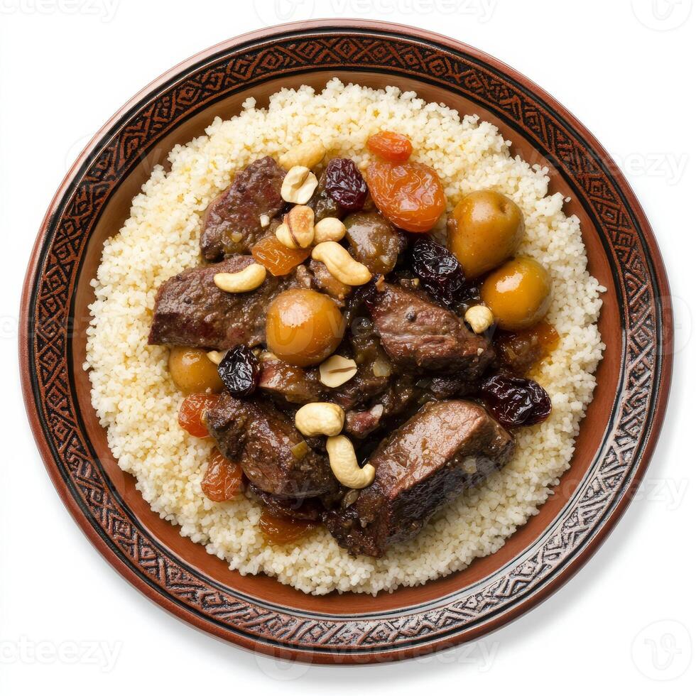 An artistic arrangement of a plate of lamb tagine, featuring tender lamb, dried fruits, and nuts, photo