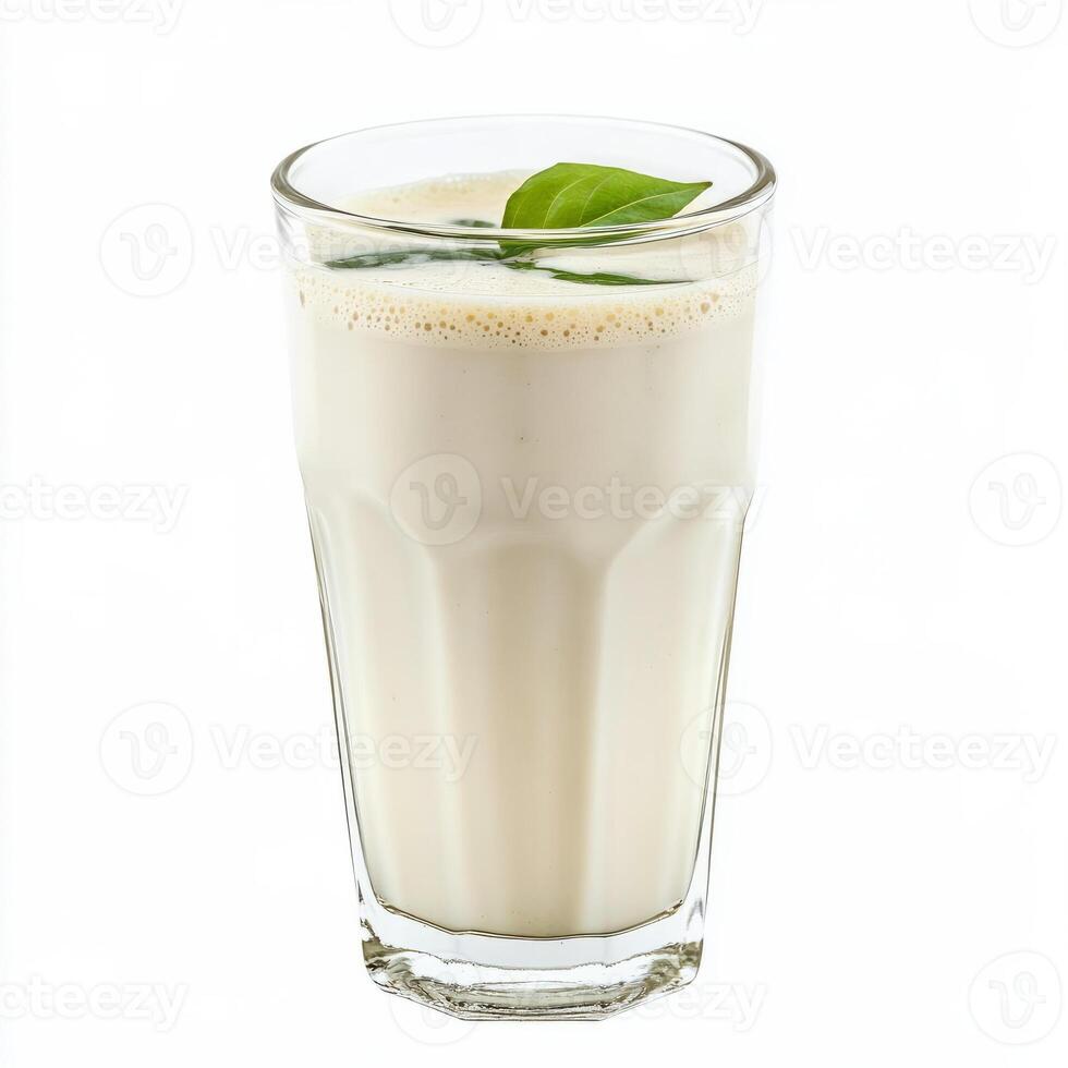 A glass of neer moru, with a refreshing drink made from buttermilk, ginger, and curry leaves, isolated on clean white background. photo
