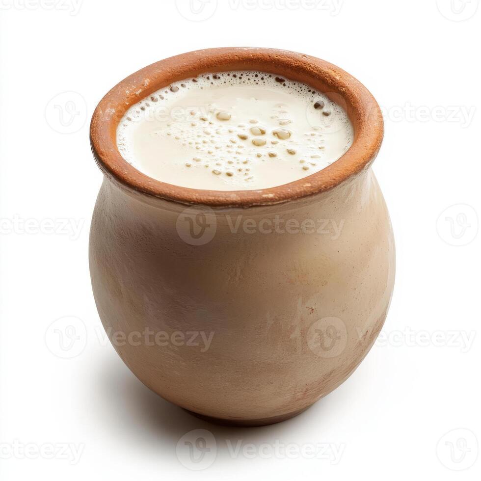 A clay pot filled with milk on a white background photo