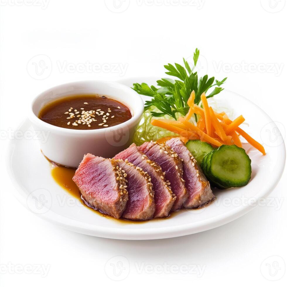 A meticulousy composed plate of seared tuna steak, served with a side of sesame-ginger sauce and pickled vegetables. The seared tuna steak, with its tender, rare center and flavorful sesame-ginger photo