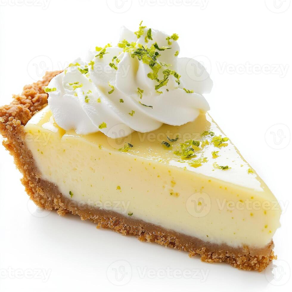 An enticing close-up of a slice of key lime pie, its creamy filling resting on a graham cracker crust, topped with whipped cream and lime zest. The key lime pie, with its tangy and sweet filling, photo