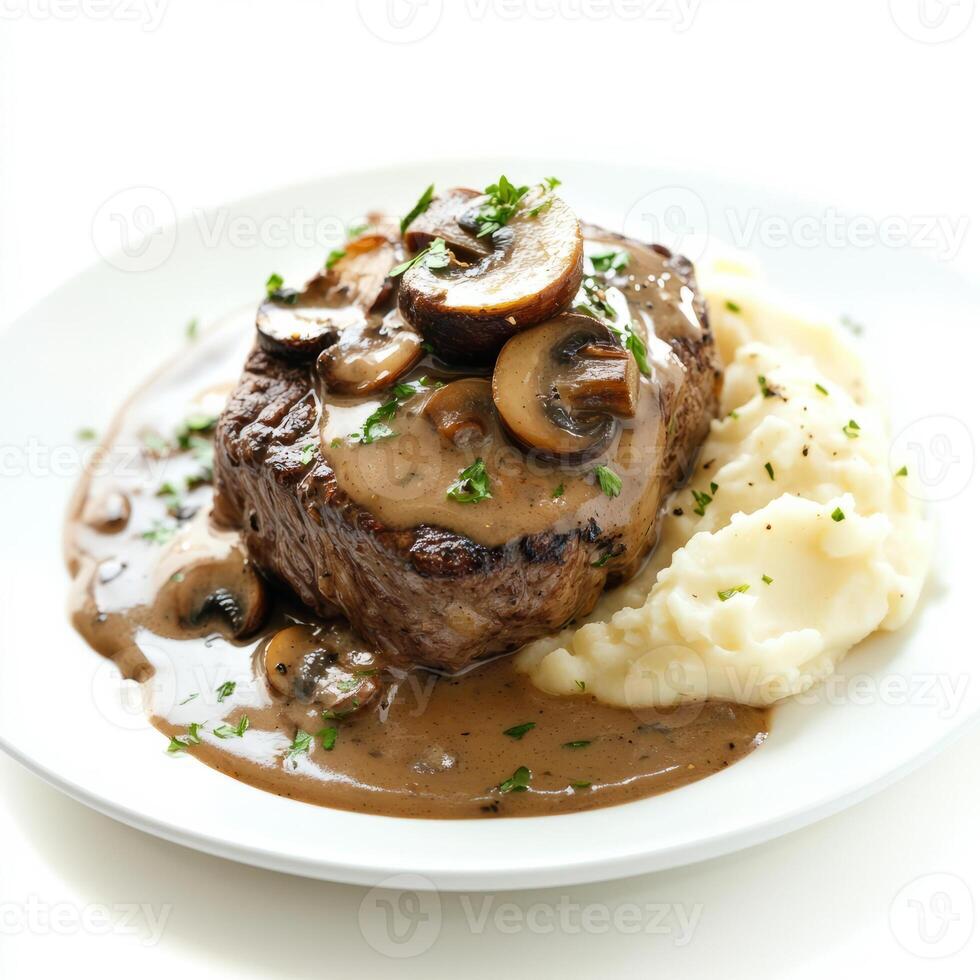 A well crafted shot of a plate of steak Diane, featuring a pan-seared steak in a creamy brandy-mushroom sauce, served with mashed potatoes. The steak Diane, with its rich, savory sauce and tender photo