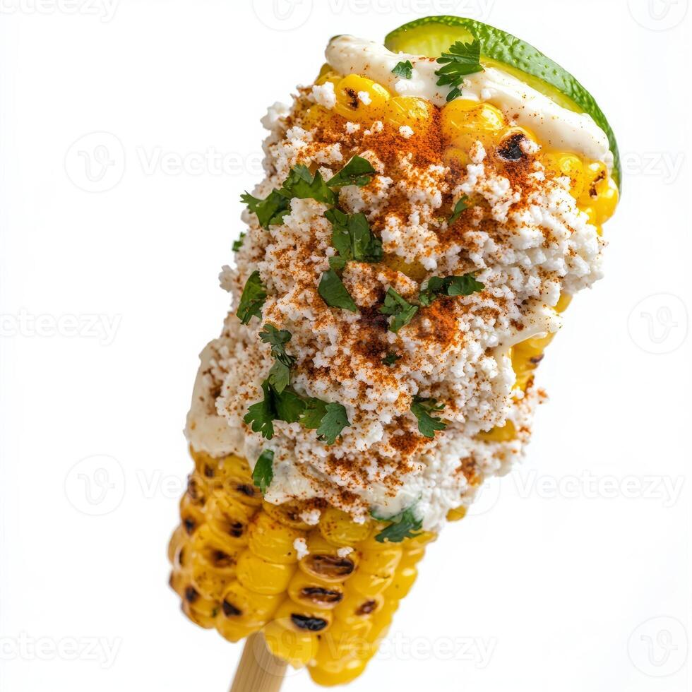 A close-up of a street-style elote, grilled corn on the cob, slathered in mayonnaise, cotija cheese, chili powder, and a squeeze of lime juice, presented on a wooden skewer, isolated on clean white photo