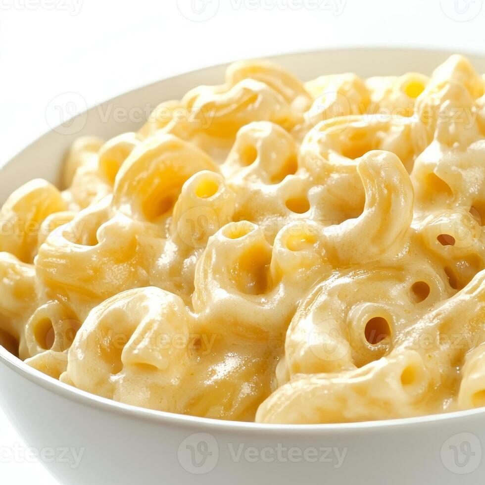 A close-up of a bowl of macaroni and cheese, its pasta creamy and cheesy, topped with a golden brown crust. The macaroni and cheese, a classic comfort food, offers a cheesy and indulgent experience. photo
