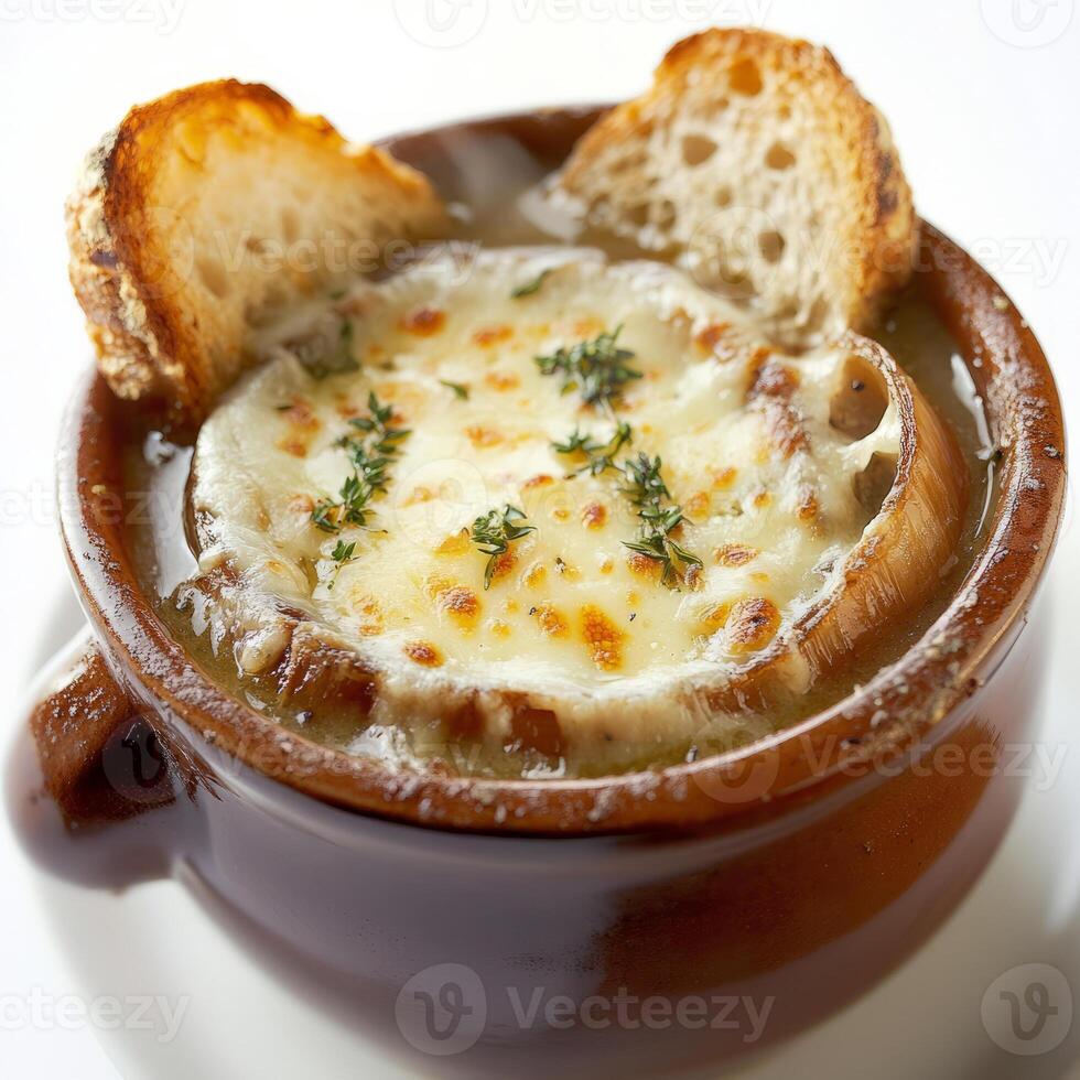 A bowl of soup with bread and herbs photo