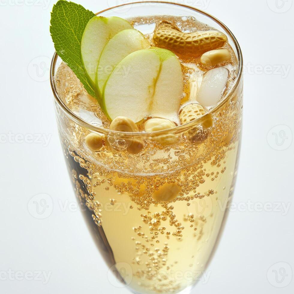 A glass of champagne with an apple and mint photo
