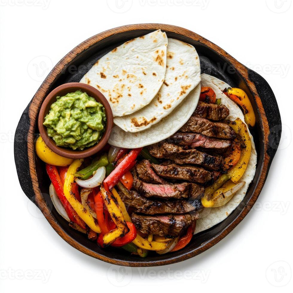 Grilled steak with peppers and guacamole on a plate photo