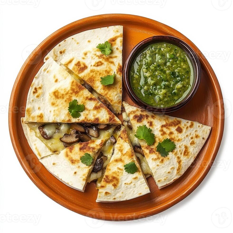 A plate of cheesy quesadillas, filled with melted Oaxaca cheese, mushrooms, and epazote, grilled until golden brown and served with a side of salsa verde, arranged on a terracotta plate, isolated on photo