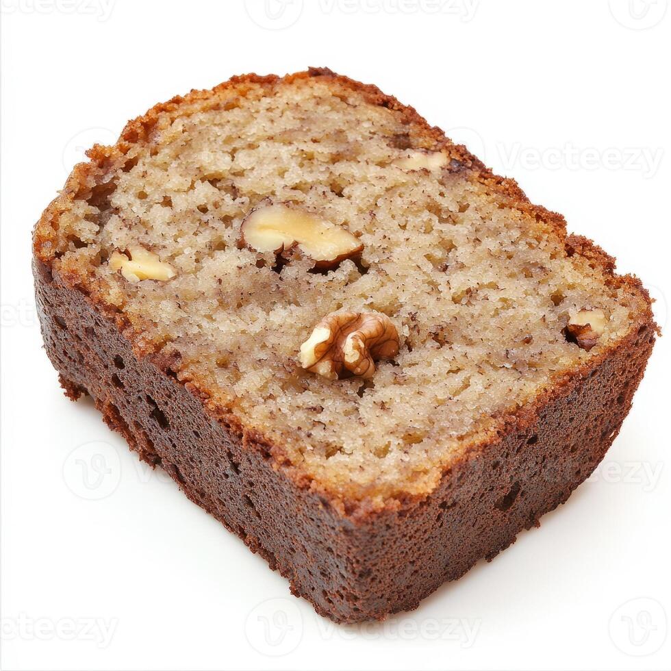 A piece of banana bread with walnuts on it photo