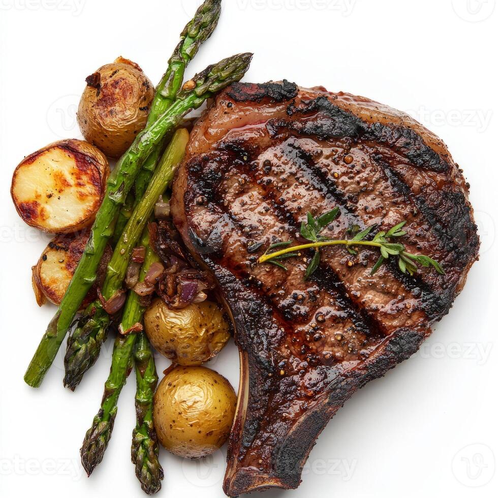 A close-up of a perfectly grilled ribeye steak, its charred surface revealing a juicy and tender interior, resting on a bed of roasted potatoes and asparagus. The ribeye steak, with its rich flavor photo