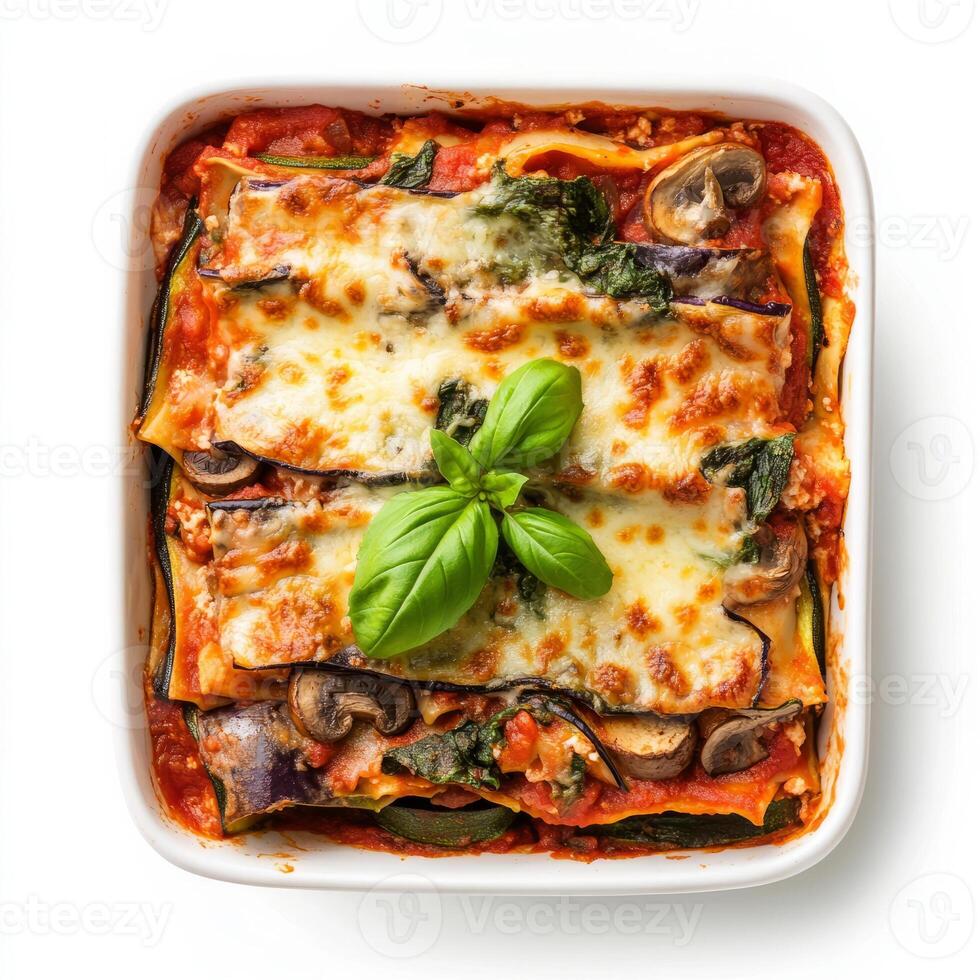 Vegetarian lasagna with mushrooms and spinach in a white dish photo