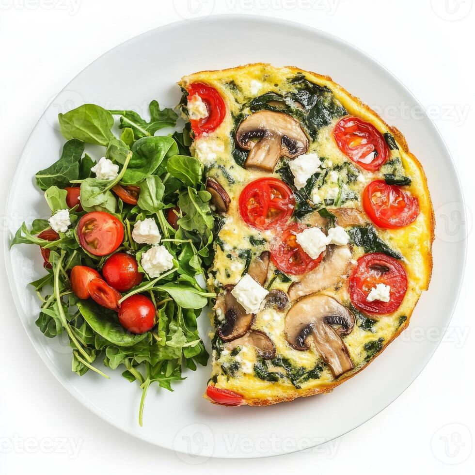 A plate with a quiche and salad on it photo
