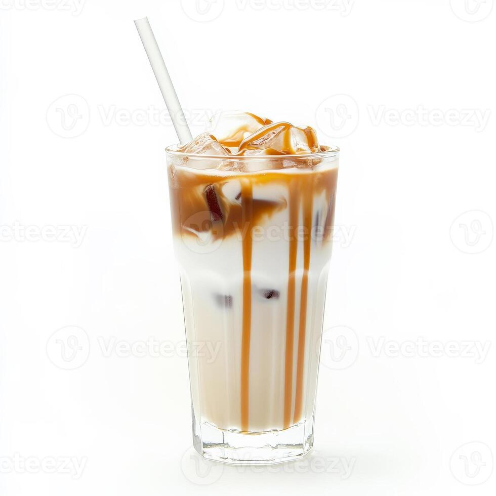 A tall glass of iced caramel macchiato, layered with espresso, milk, and drizzled caramel syrup, served with ice cubes and a straw. A popular coffeehouse drink. Isolated on clean white background photo