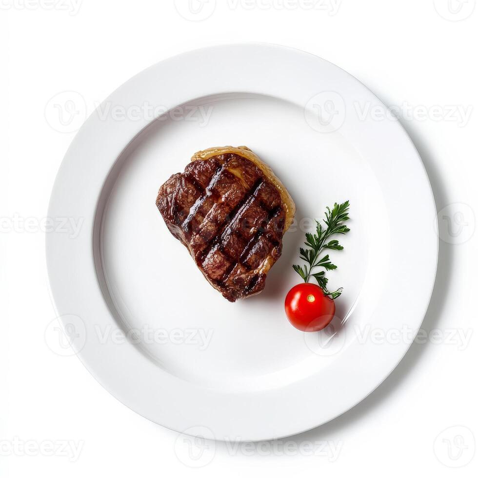 A piece of steak on a white plate with a cherry photo