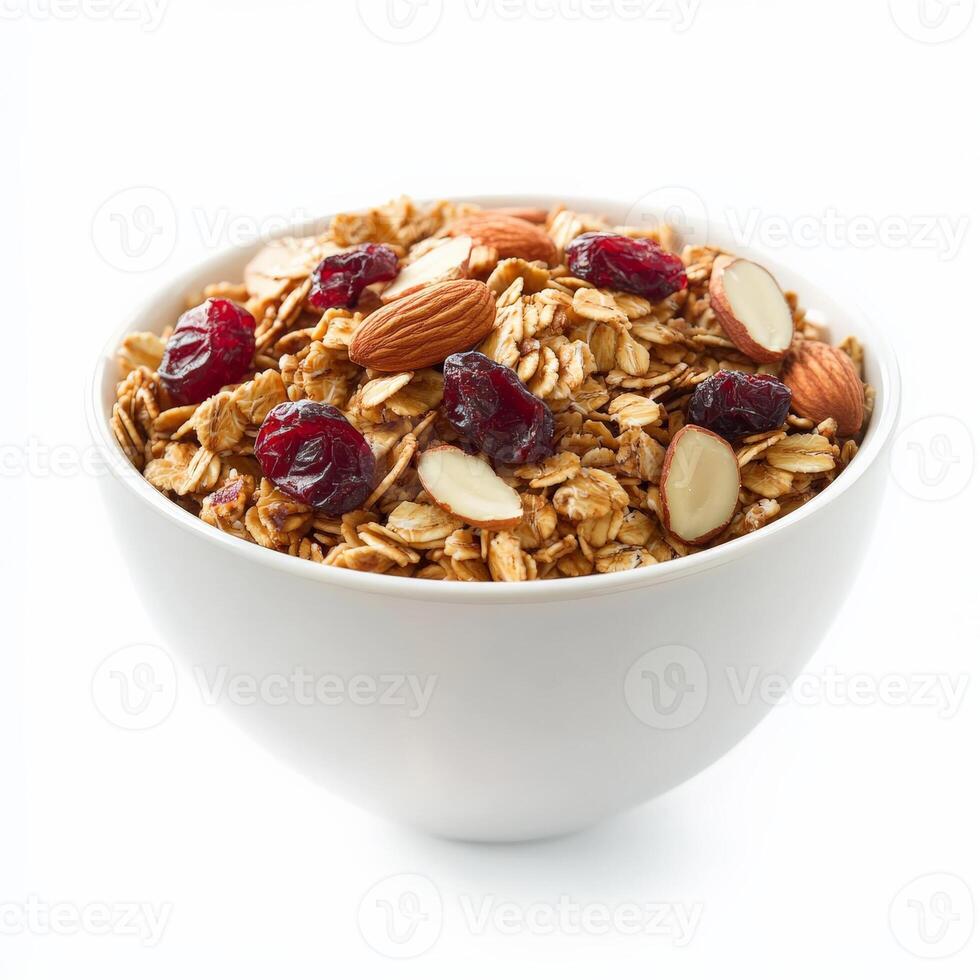 A bowl of homemade granola with rolled oats, almonds, dried cranberries, and honey-roasted nuts. Served with fresh yogurt for a healthy and crunchy breakfast. Isolated on clean white background photo