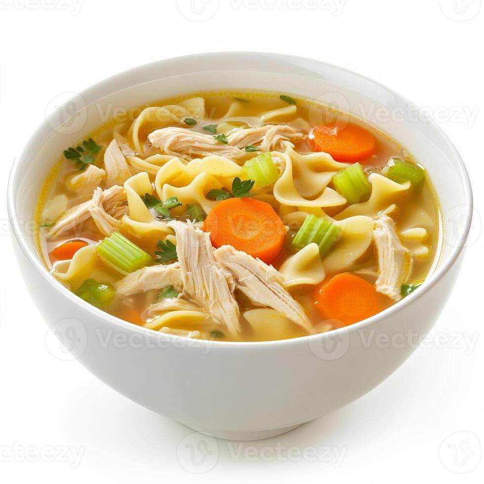 A steaming bowl of classic chicken noodle soup with tender shredded chicken, egg noodles, carrots, and celery in a flavorful golden broth. A comforting dish for any season. Isolated on clean white photo