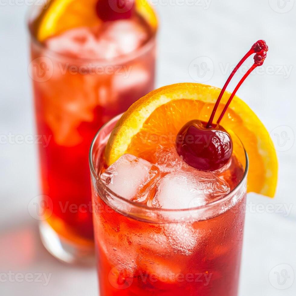A close-up of a refreshing Campari Orange cocktail, a classic Italian drink, made with Campari, orange juice, and a splash of soda water, served in a highball glass filled with ice, garnished with an photo